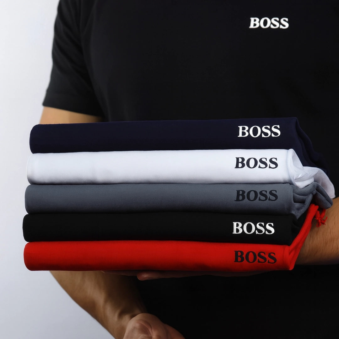 PureClo™ Premium T-Shirts neatly folded in multiple colours – soft cotton, modern fit, essential everyday wear.